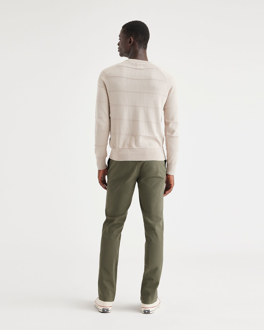 Back view of model wearing Army Green Alpha Chino Pants, Slim Fit.