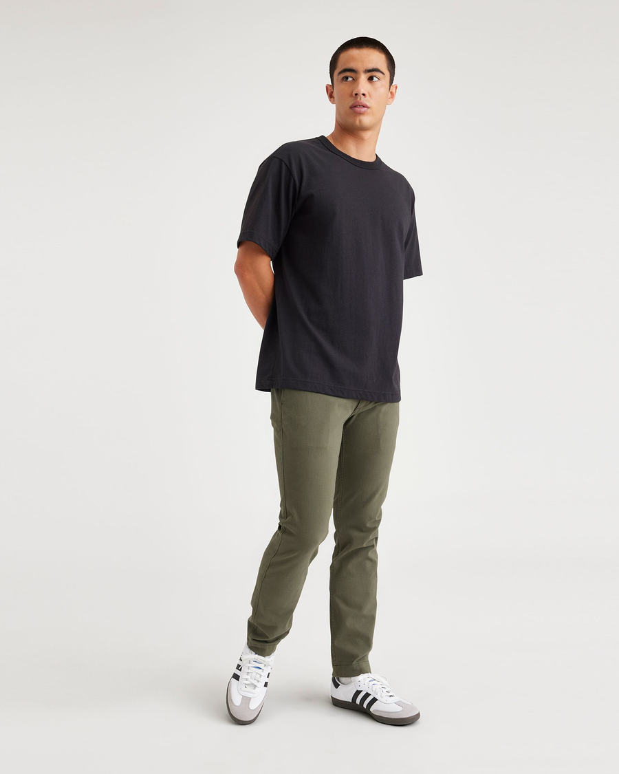 View of model wearing Army Green Men's Skinny Fit Smart 360 Flex California Chino Pants.