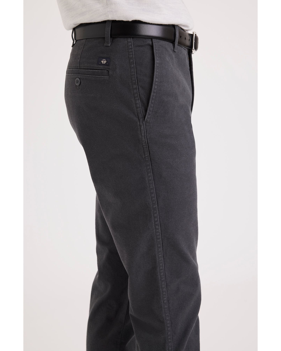 Side view of model wearing Asphalt Men's Slim Fit Original Chino Pants.