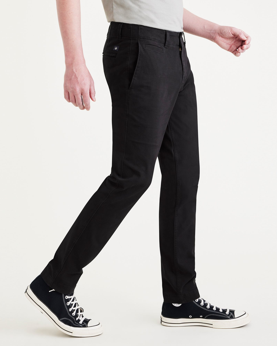 Side view of model wearing Beautiful Black Alpha Chino Pants, Skinny Fit.