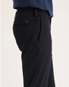 Side view of model wearing Beautiful Black Chino Go Activeflex, fit skinny.