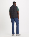 Back view of model wearing Beautiful Black Men's Nylon Lightweight Quilted Vest.