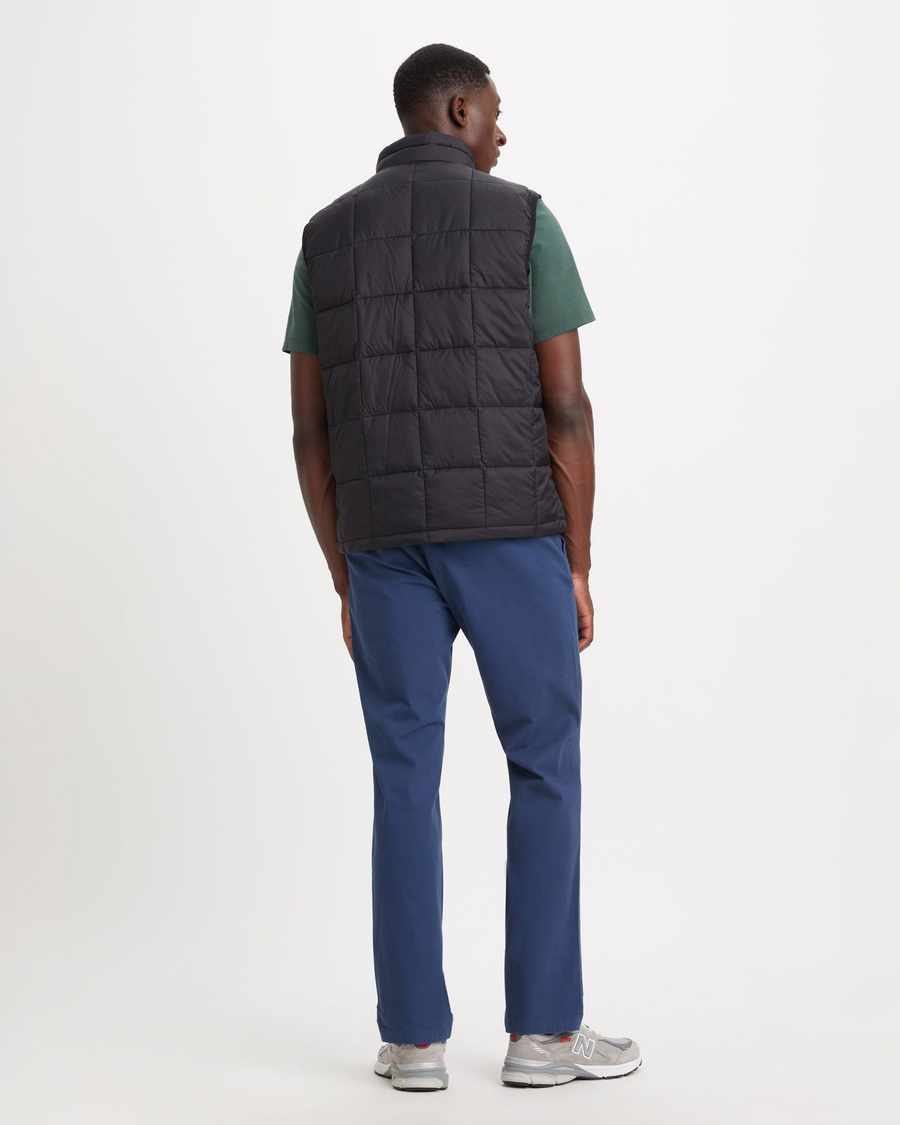 Back view of model wearing Beautiful Black Men's Nylon Lightweight Quilted Vest.