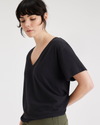 View of model wearing Beautiful Black Women's Deep V-Neck Tee Shirt.