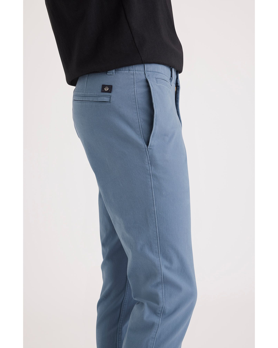 Side view of model wearing Bluefin Alpha Chino Pants, Skinny Fit.