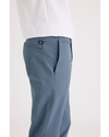 Side view of model wearing Bluefin Alpha Chino Pants, Slim Fit.