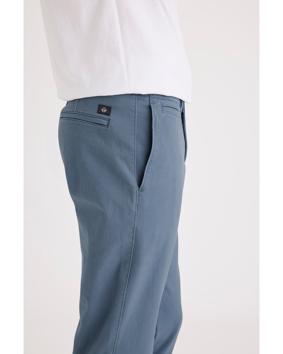 Side view of model wearing Bluefin Alpha Chino Pants, Slim Fit.