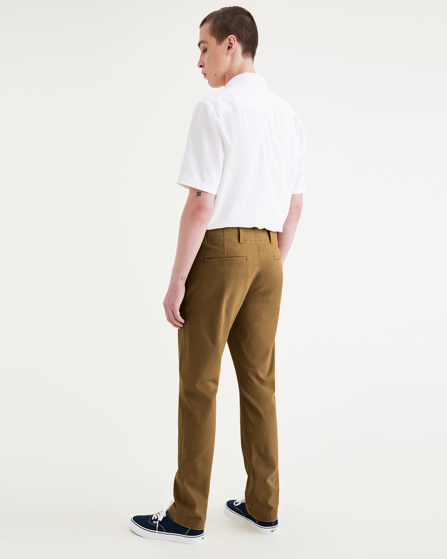 Back view of model wearing Bronze Brown Alpha Chino Pants, Slim Fit.