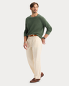 View of model wearing Buttercream Eighty-Six Original Pleated Chinos, Loose Fit.