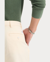 View of model wearing Buttercream Eighty-Six Original Pleated Chinos, Loose Fit.