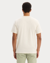 Back view of model wearing Buttercream Graphic Tee, Regular Fit.
