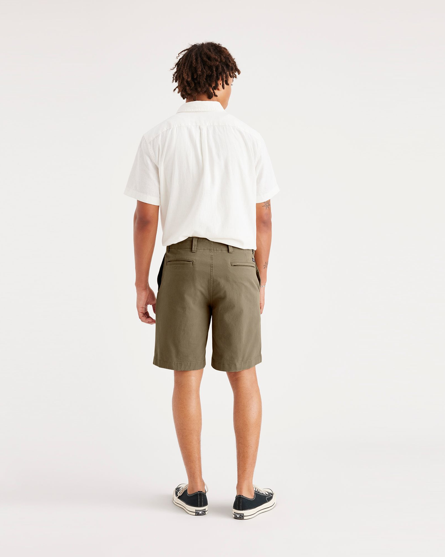Back view of model wearing Camo Men's Straight Fit California Shorts.
