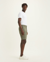 Side view of model wearing Camo Men's Supreme Flex Modern Chino Short.