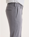 Side view of model wearing Car Park Grey Go Activeflex Chino, Skinny Fit.