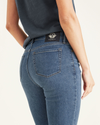 View of model wearing Cassidy Light Rinse Women's Mid-Rise Skinny Jean Cut Pants.