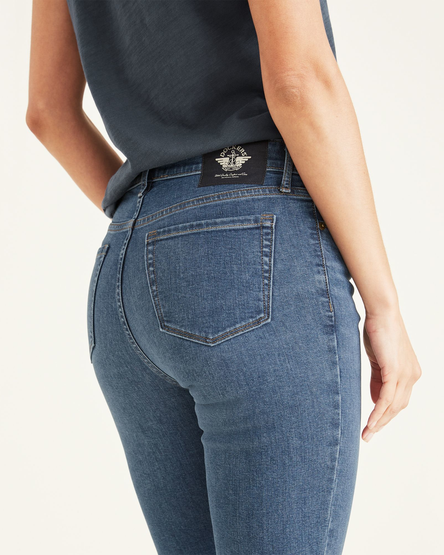 View of model wearing Cassidy Light Rinse Women's Mid-Rise Skinny Jean Cut Pants.