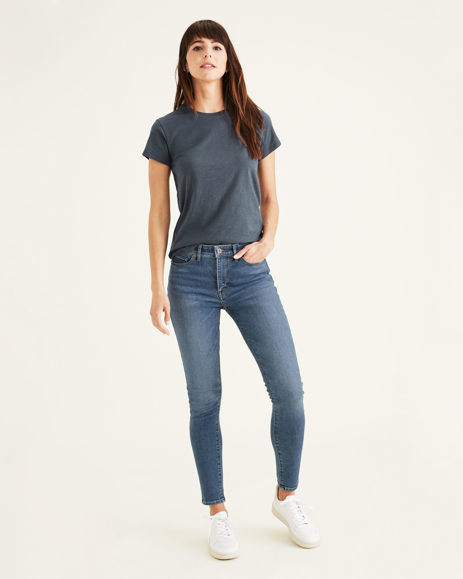 Front view of model wearing Cassidy Light Rinse Women's Mid-Rise Skinny Jean Cut Pants.