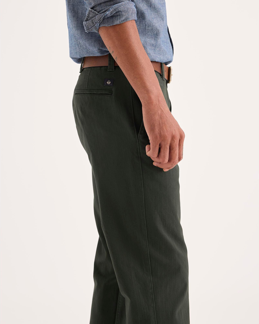 Side view of model wearing Chimera Alpha Chino Pants, Slim Fit.