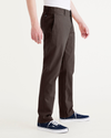 Side view of model wearing Coffee Bean Alpha Chino Pants, Slim Fit.