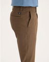 Side view of model wearing Coffee Liquer Alpha Chino Pants, Skinny Fit.