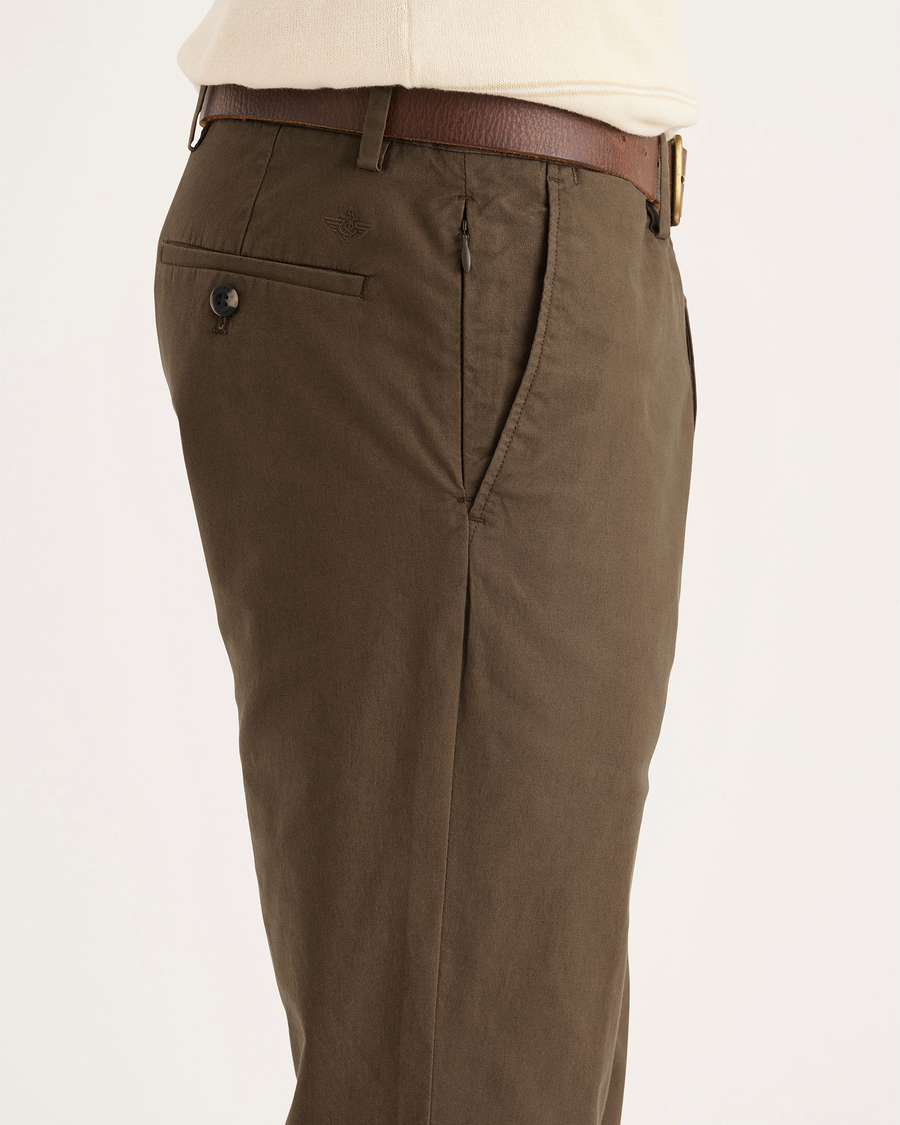 Side view of model wearing Coffee Liquer Crafted Khaki Pants, Slim Fit.