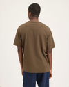 Back view of model wearing Coffee Liquer Men's Relaxed Fit Eighty-Six Crewneck Fit.