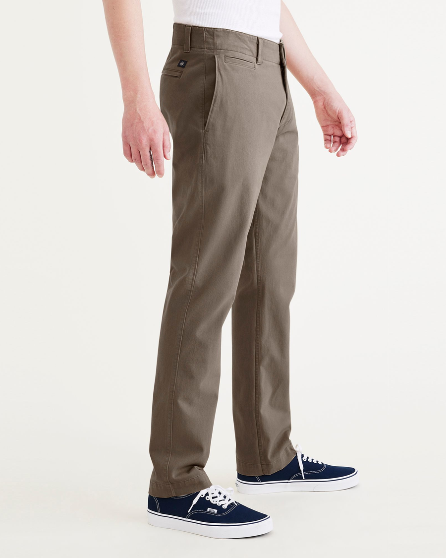 Side view of model wearing Crocodile Stonewash Men's Slim Fit Smart 360 Flex California Chino Pants.