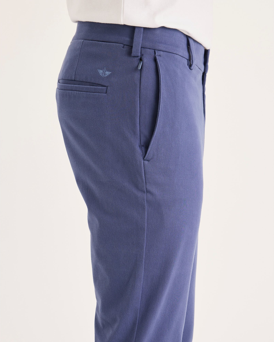 Side view of model wearing Crown Blue Go Activeflex Chino, Skinny Fit.