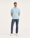 Front view of model wearing Crown Blue Men's Skinny Fit Original Chino Pants.