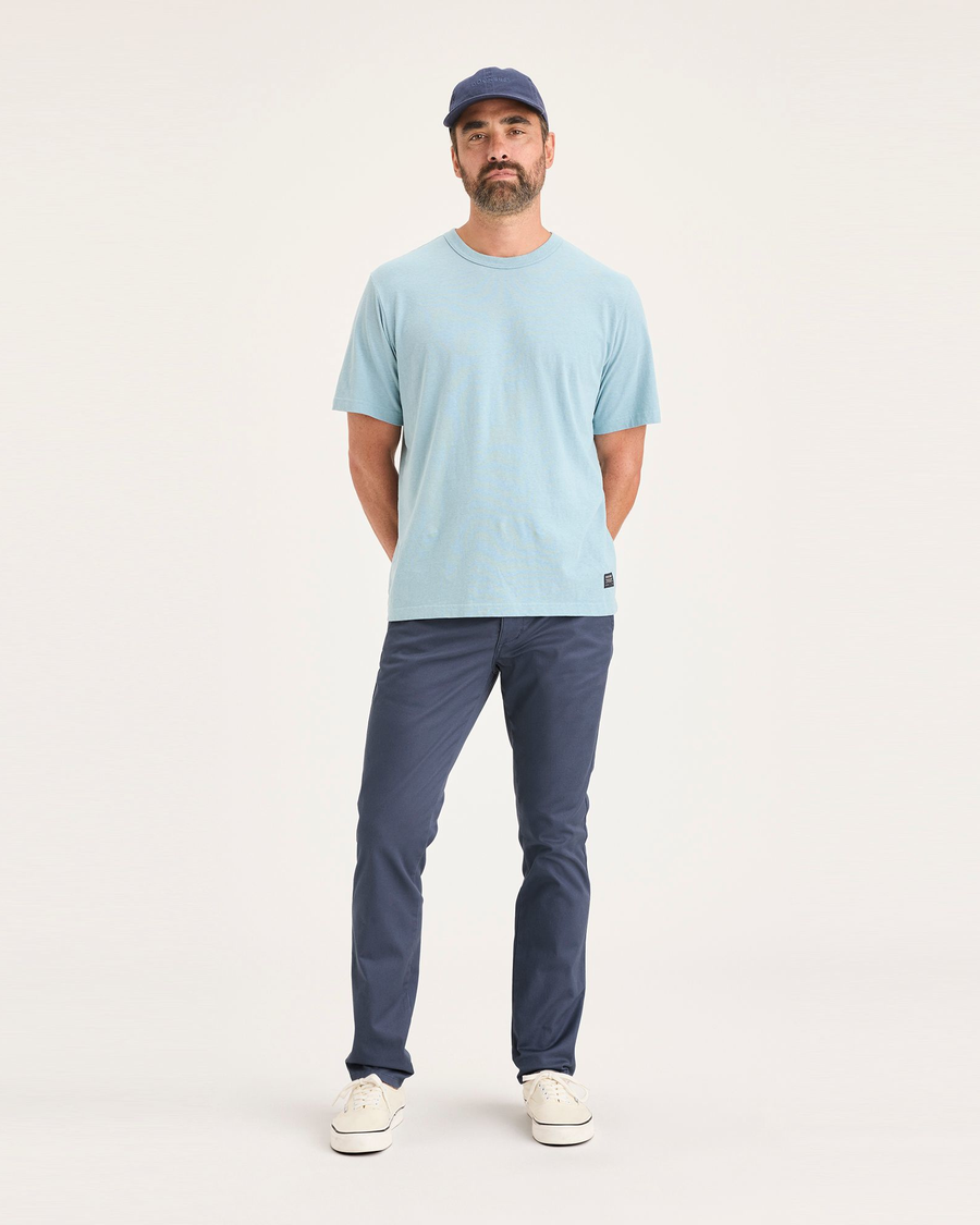 Front view of model wearing Crown Blue Men's Skinny Fit Original Chino Pants.