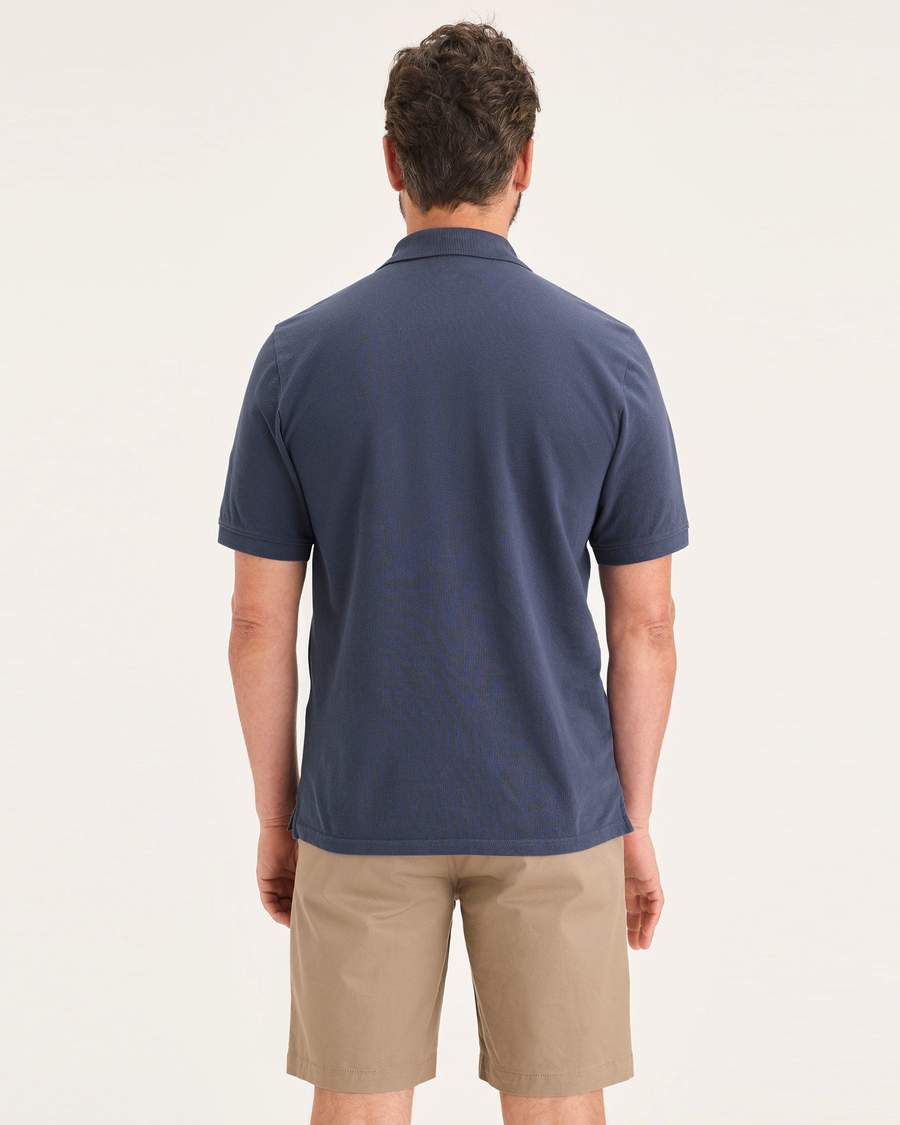 Back view of model wearing Crown Blue Men's Slim Fit Pique Polo.