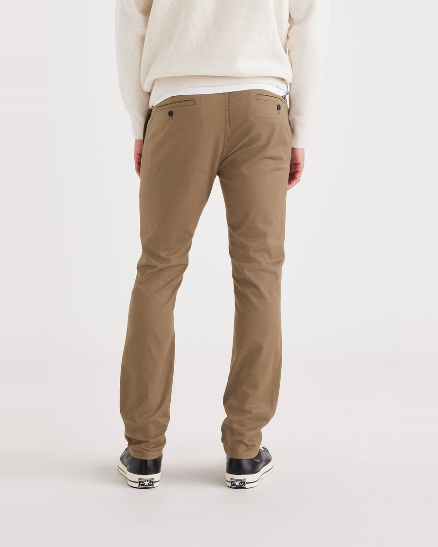 Back view of model wearing Cub Men's Skinny Fit Original Chino Pants.