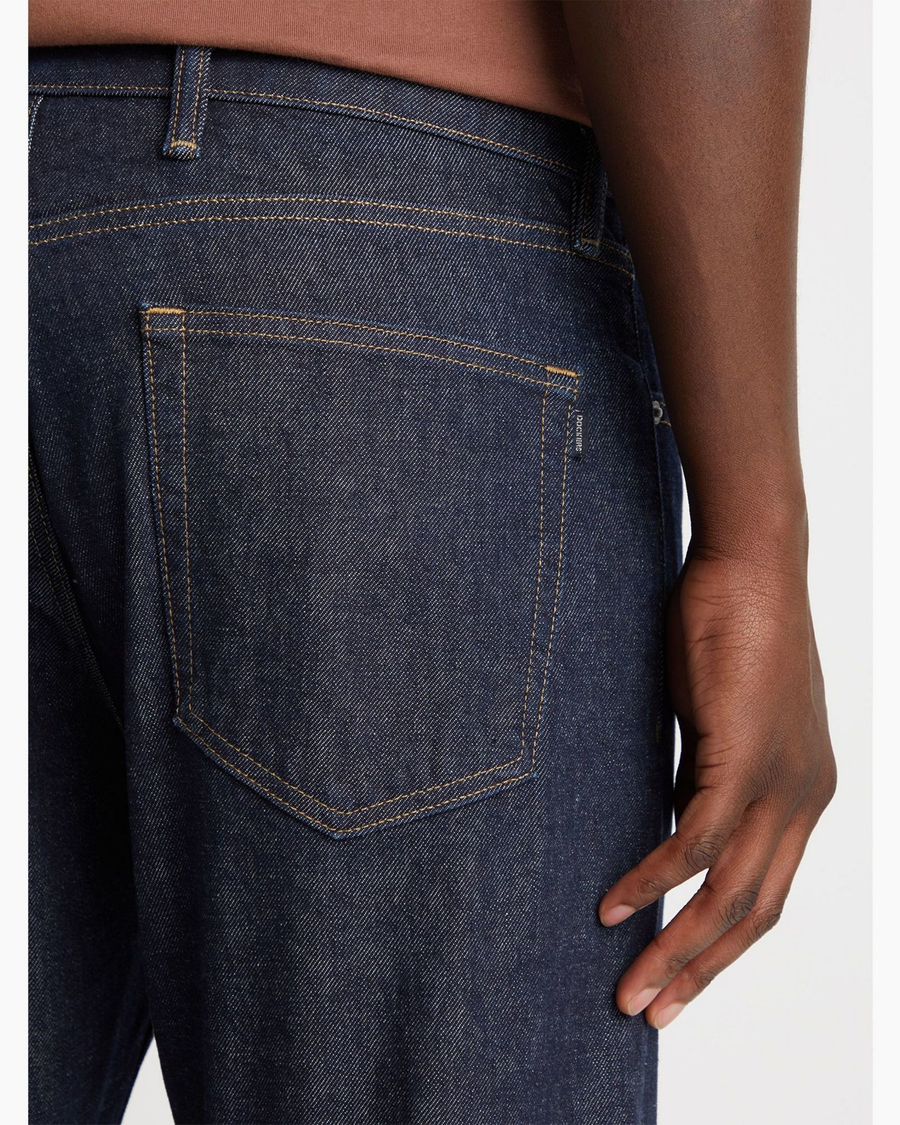View of model wearing Dark Indigo Rinse Men's Slim Fit Smart 360 Flex Jean Cut Pants.