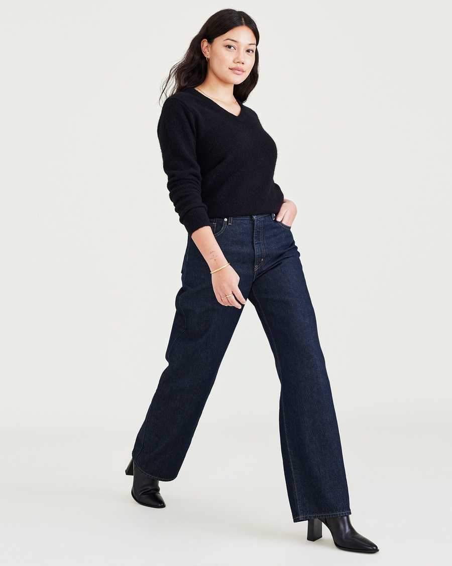 View of model wearing Dark Indigo Stonewash Women's Relaxed Fit Mid-Rise Jeans.