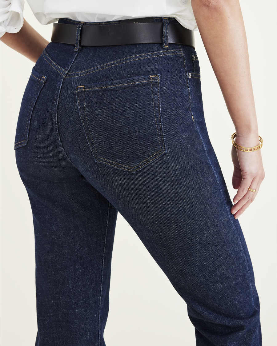 View of model wearing Dark Indigo Stonewash Women's Slim Fit High Jean Cut Pants.
