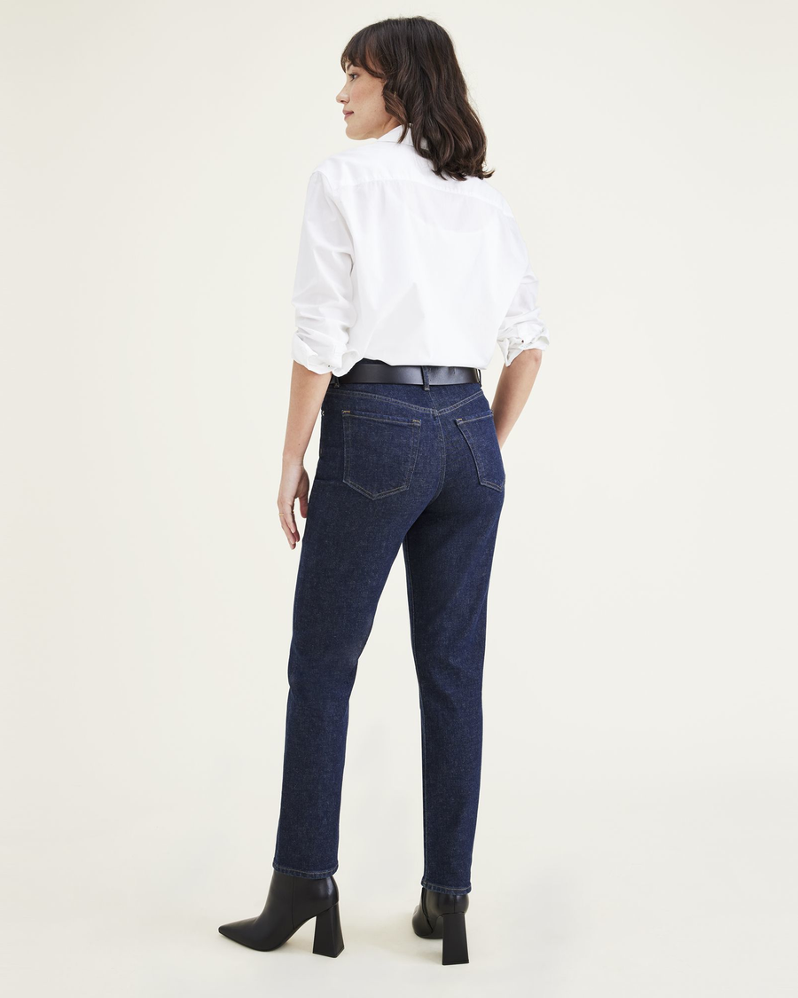 Back view of model wearing Dark Indigo Stonewash Women's Slim Fit High Jean Cut Pants.