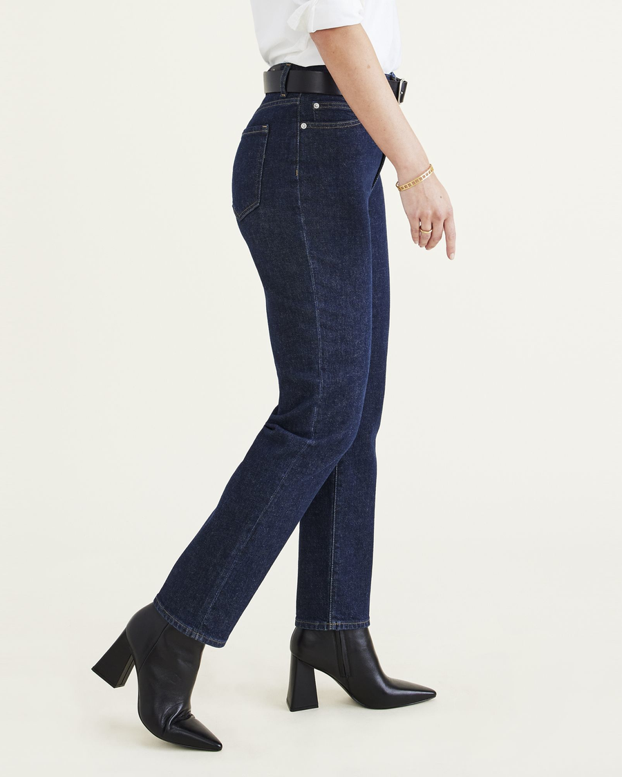 Side view of model wearing Dark Indigo Stonewash Women's Slim Fit High Jean Cut Pants.