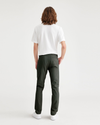 Back view of model wearing Deep Forest Alpha Chino Pants, Skinny Fit.