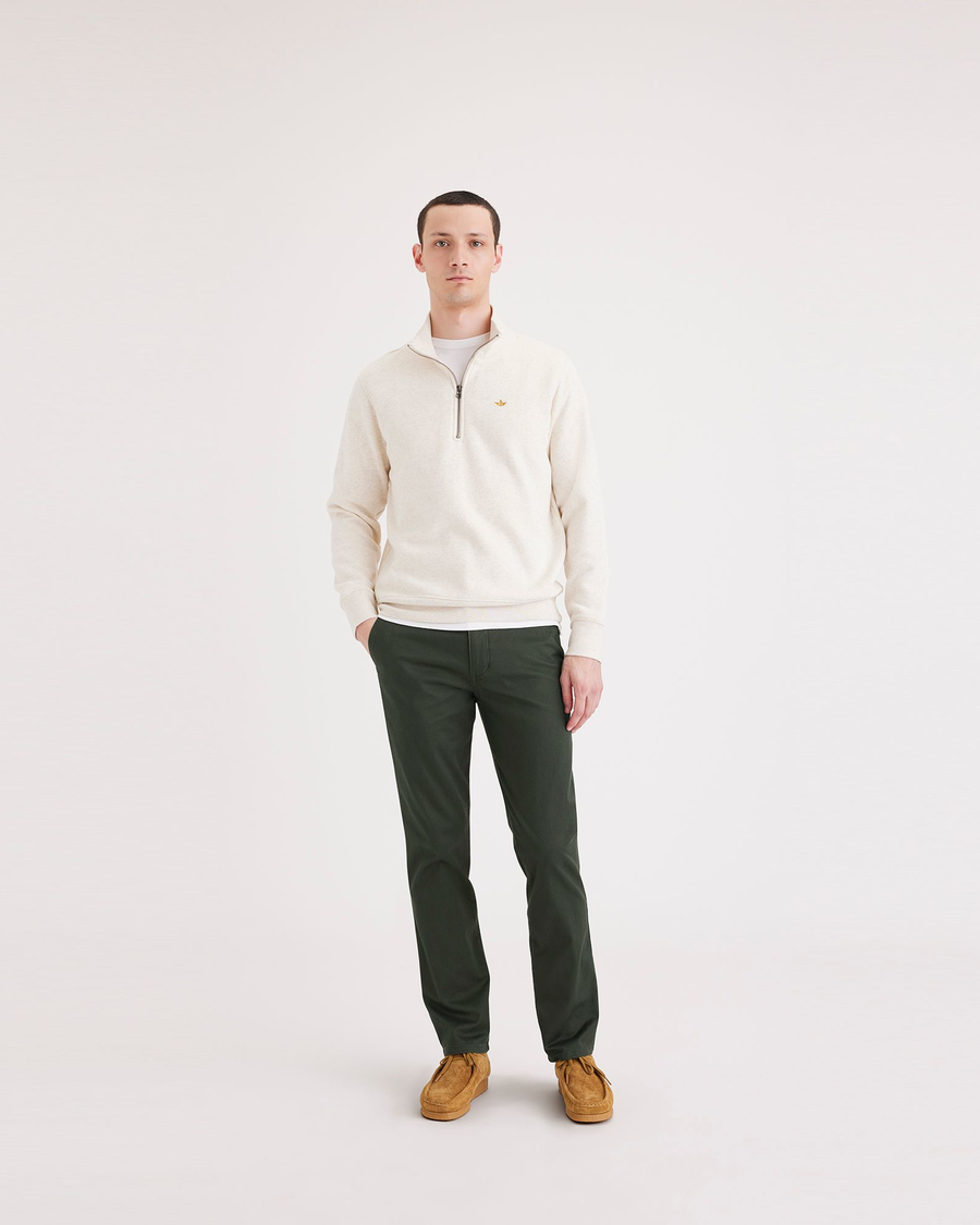 Front view of model wearing Deep Forest Men's Slim Fit Original Chino Pants.