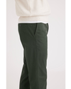 Side view of model wearing Deep Forest Men's Slim Fit Original Chino Pants.