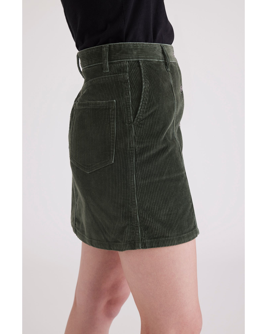 Side view of model wearing Deep Forest Women's Button Front Mini Skirt.