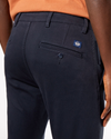 View of model wearing Dockers Navy Men's Skinny Fit Supreme Flex Alpha Khaki Pants.