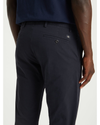 View of model wearing Dockers Navy Men's Slim Tapered Fit Smart 360 Flex Alpha Chino Pants.