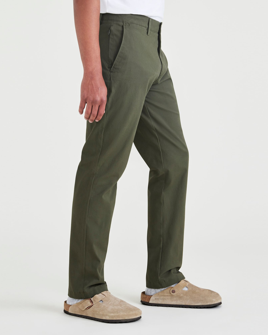 Side view of model wearing Dockers Olive Crafted Khaki Pants, Slim Fit.