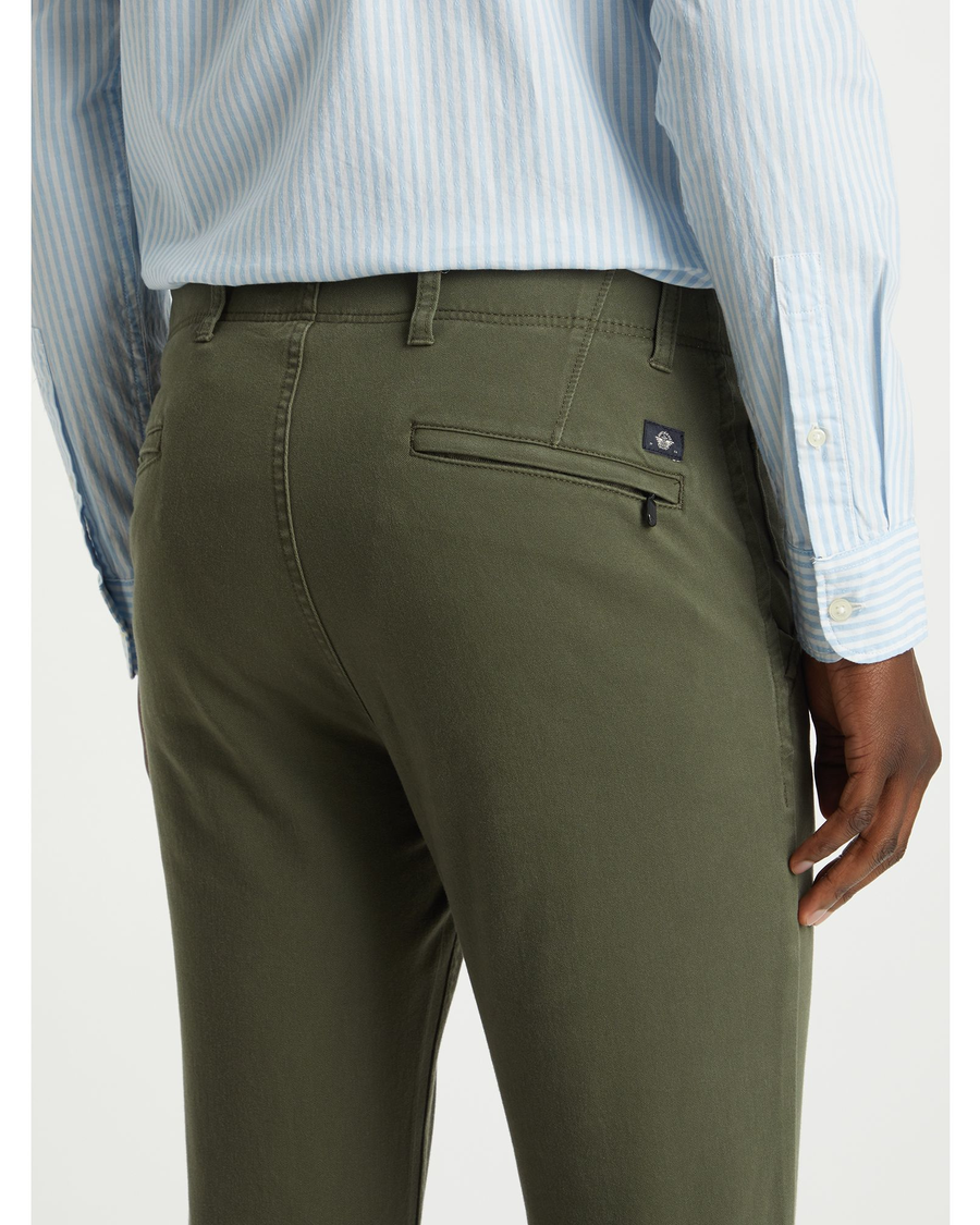View of model wearing Dockers Olive Men's Skinny Fit Smart 360 Flex Alpha Khaki Pants.