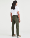 Back view of model wearing Dockers Olive Men's Slim Fit Smart 360 Flex Alpha Chino Pants.
