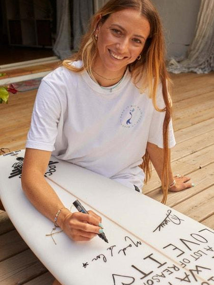 Maud Le Car signing surf board