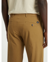 View of model wearing Ermine Men's Slim Tapered Fit Smart 360 Flex Alpha Chino Pants.