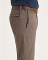 Side view of model wearing Fossil Alpha Chino Pants, Slim Fit.