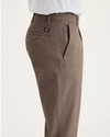 Side view of model wearing Fossil Men's Slim Fit Smart 360 Flex Ultimate Chino Pants.